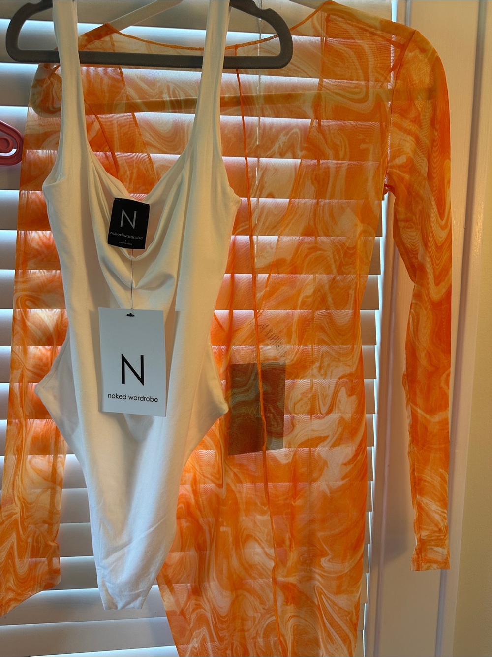 naked wardrobe 
White Scoop Bodysuit with Orange Swirl Mesh Cover-Up